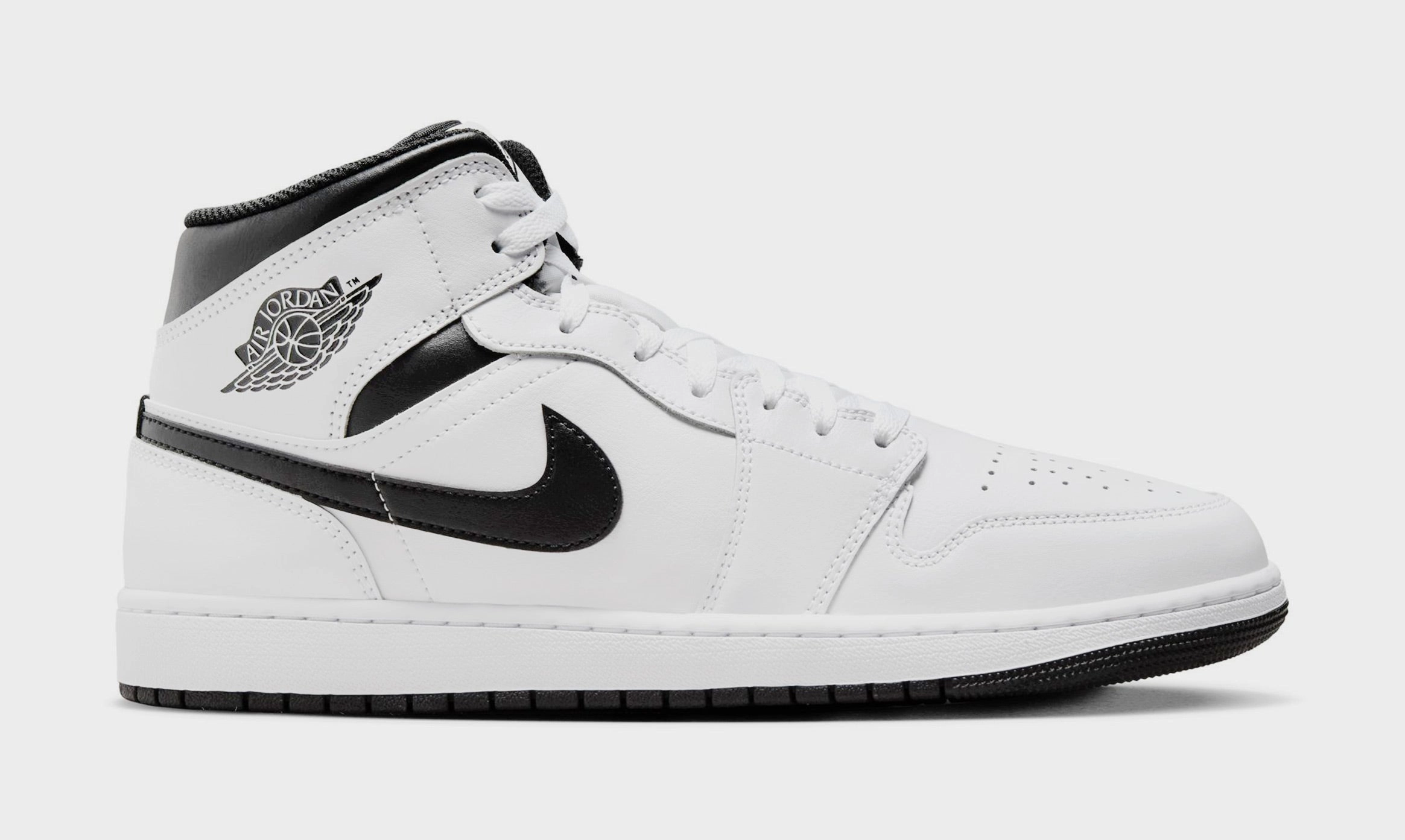 Air Jordan 1 Mid Mens Basketball Shoes (White/Black) Air Jordan 1 classic shoes for streetwear looks